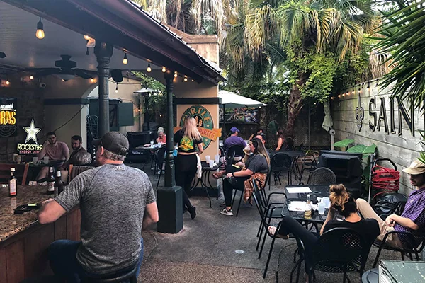Guests gathering in Turtle Bay’s French Quarter courtyard